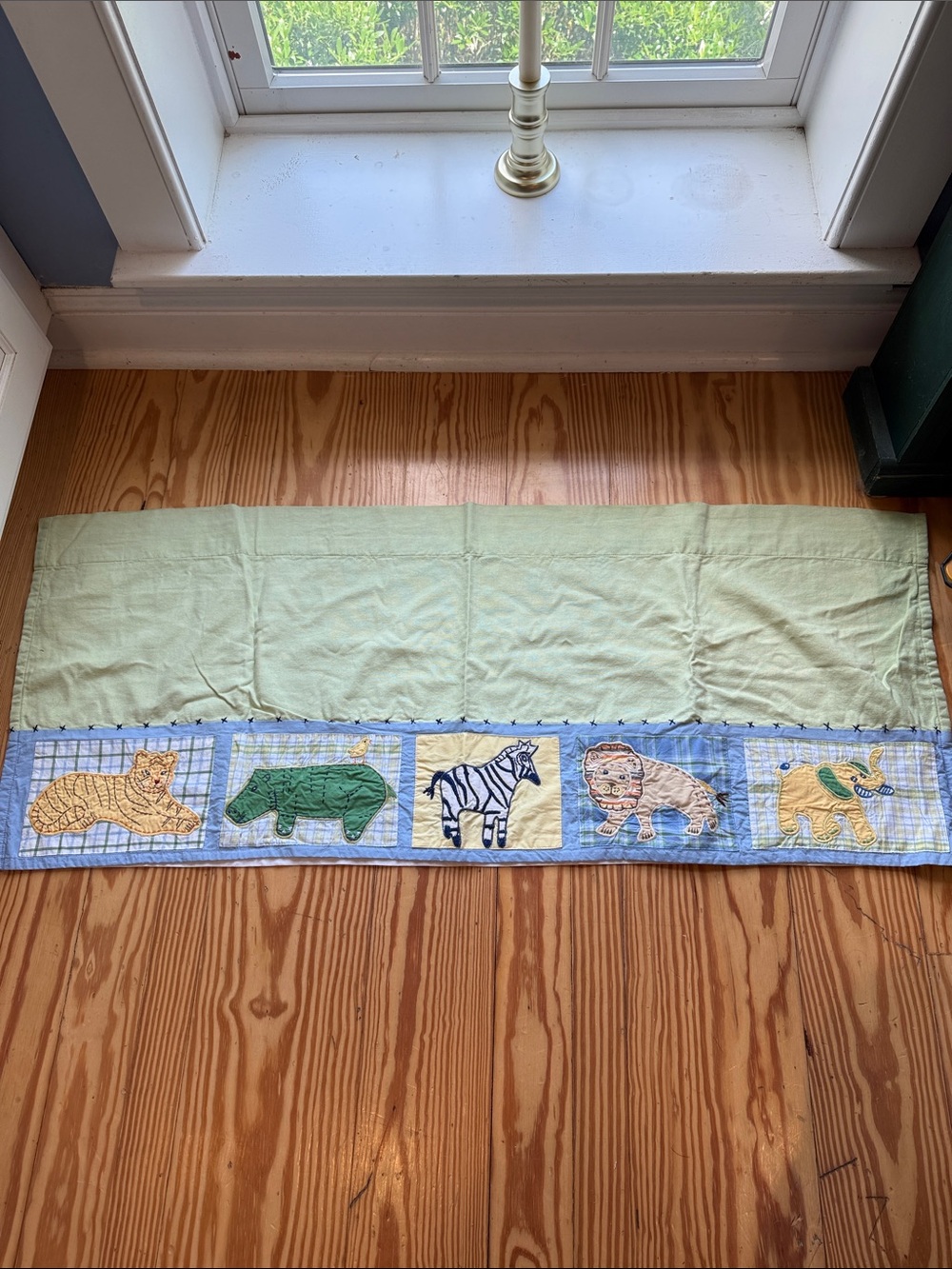 Pottery Barn Kids Green quilted window treatment.